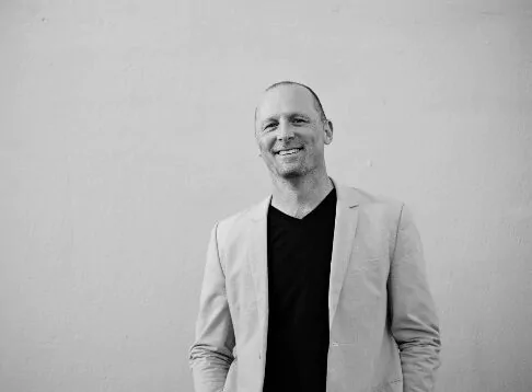 Jamie Oehlers black and white photo against light background.