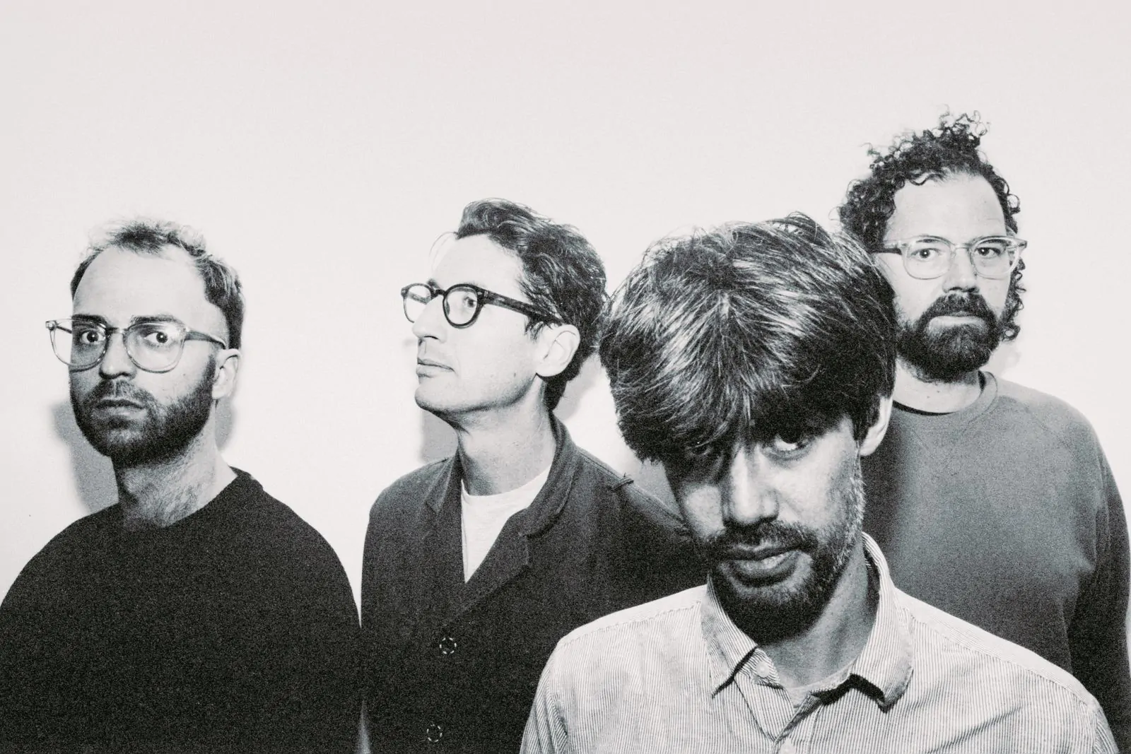 Stylised black and white photo with drummer and composer Laurence Pike, bassist Clayton Thomas, keyboardist Novak Manojlovic, alto saxophonist Peter Farrar.